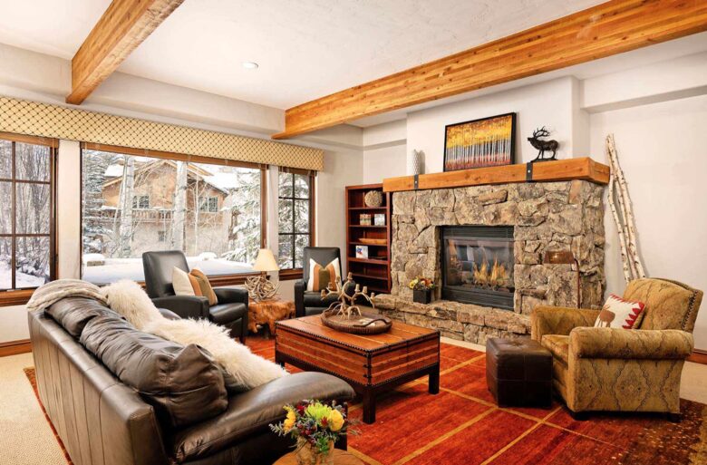 Downstairs media room with fireplace