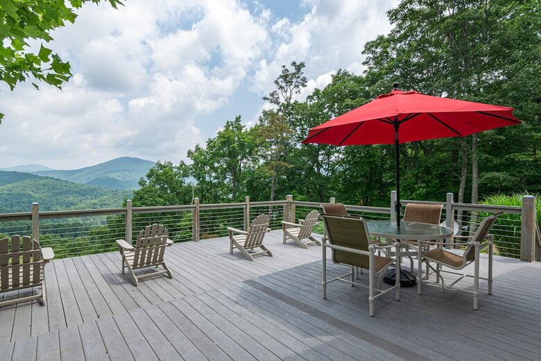 Home exchange in Fairview NC, deck with Adirondack chairs