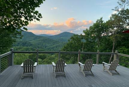 Home exchange in Fairview NC, deck with seating at sunset