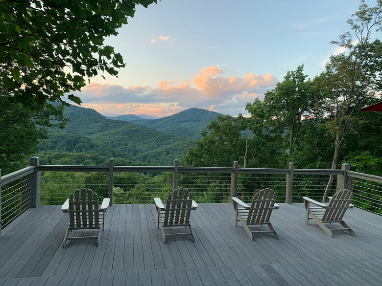 Home exchange in Fairview NC, deck with seating at sunset