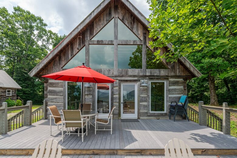 Home exchange in Fairview NC, deck with table, chairs & red umbrella