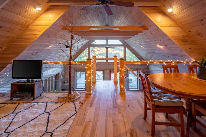 Home exchange in Fairview NC, upper loft with string lights