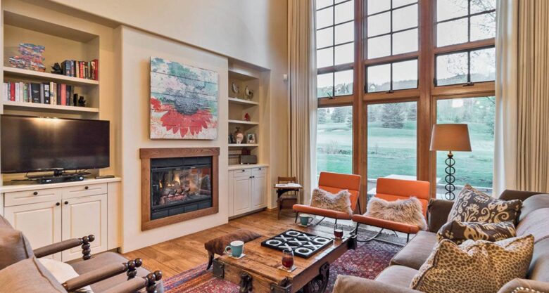 Open living room with views of the golf course and mountains