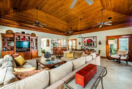 Home Exchange in Playa Langosta, Costa Rica living room beamed ceiling