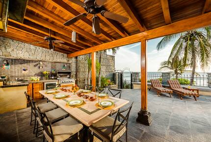 Home Exchange in Playa Langosta, Costa Rica dine alfresco with fans