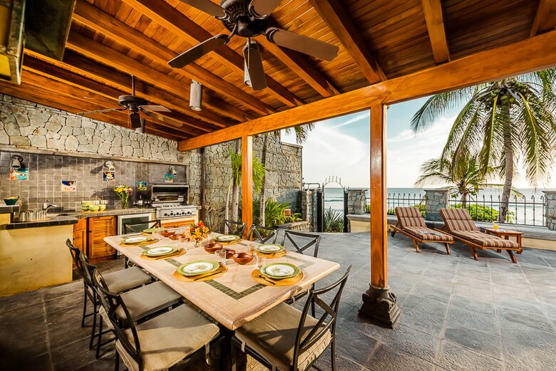 Home Exchange in Playa Langosta, Costa Rica dine alfresco with fans