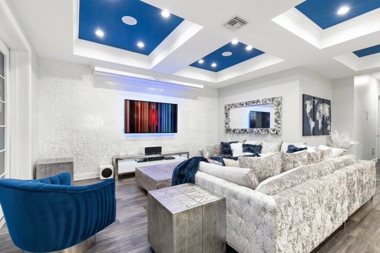 Home Exchange in Reunion, FL, family room with tv and projector