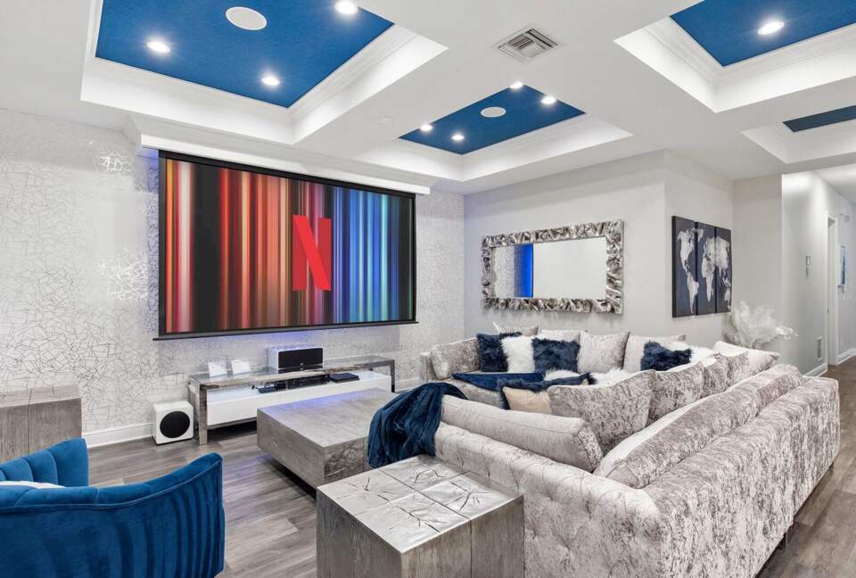 Home Exchange in Reunion, FL, family room with a projector