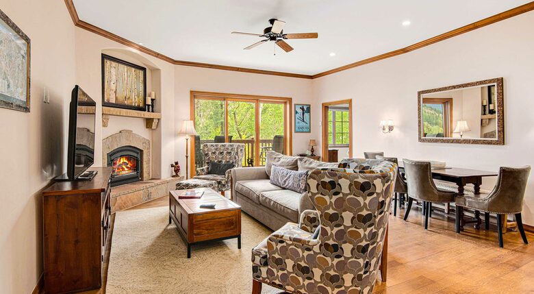 Home Exchange in Beaver Creek, CO, living room with a cozy fireplace
