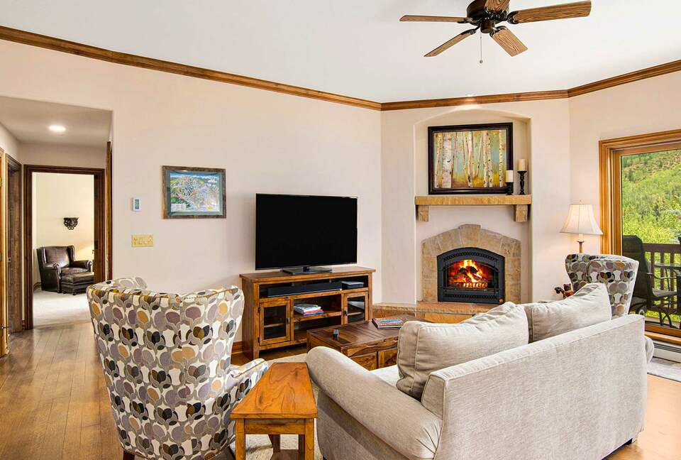Home Exchange in Beaver Creek, CO, living room with a cozy fireplace