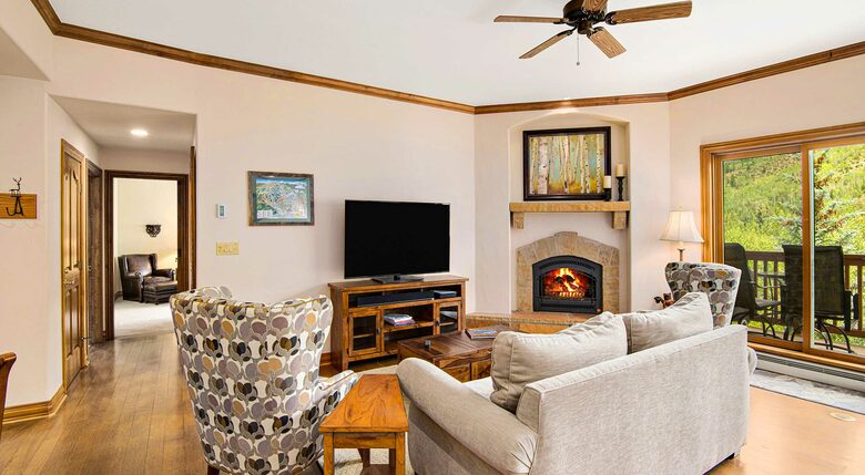 Home Exchange in Beaver Creek, CO, living room with a cozy fireplace