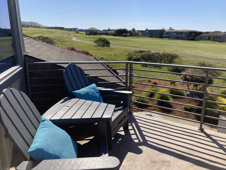 Seating for 2 on primary bedroom balcony.