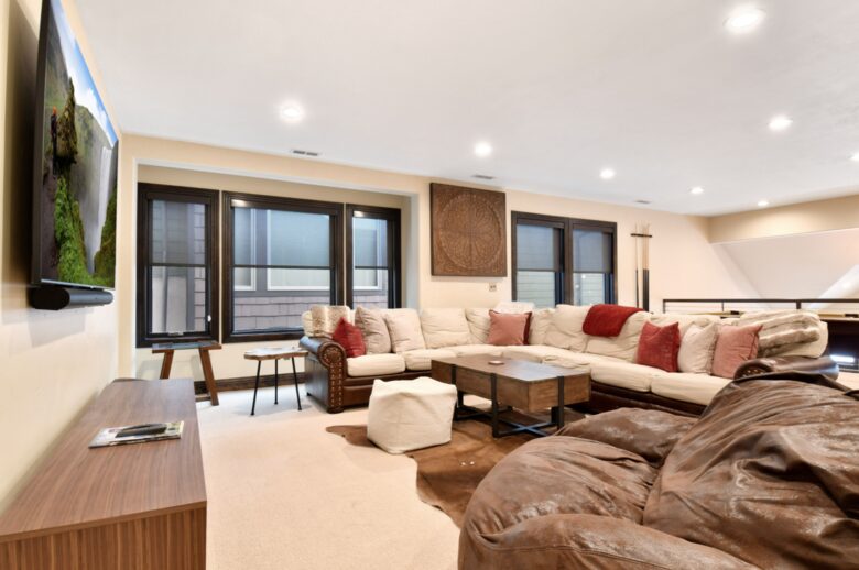 Loft with large sofa and pool table