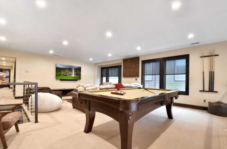 Loft with large sofa and pool table