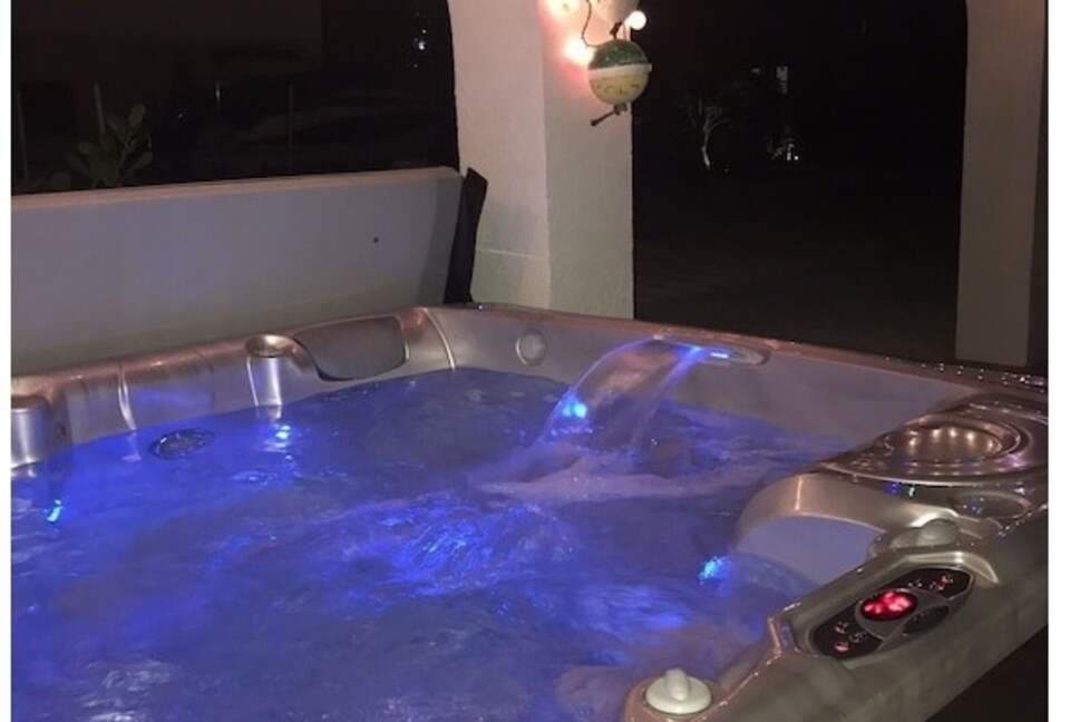 Home Exchange in Marathon, FL night view of the six person hot tub