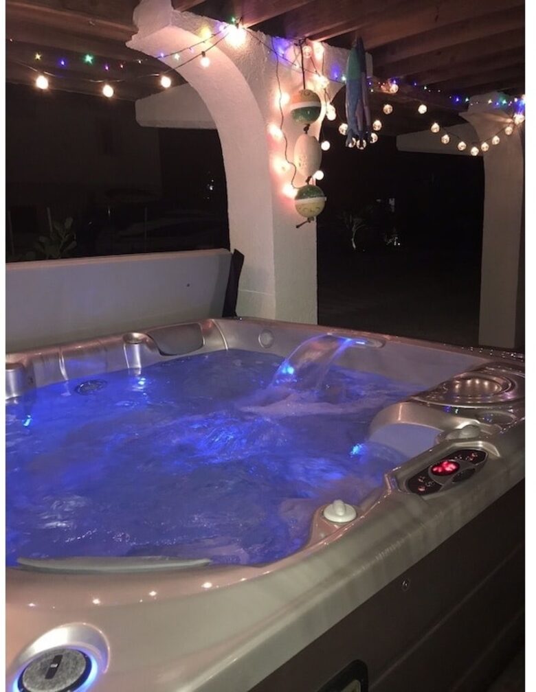 Home Exchange in Marathon, FL night view of the six person hot tub