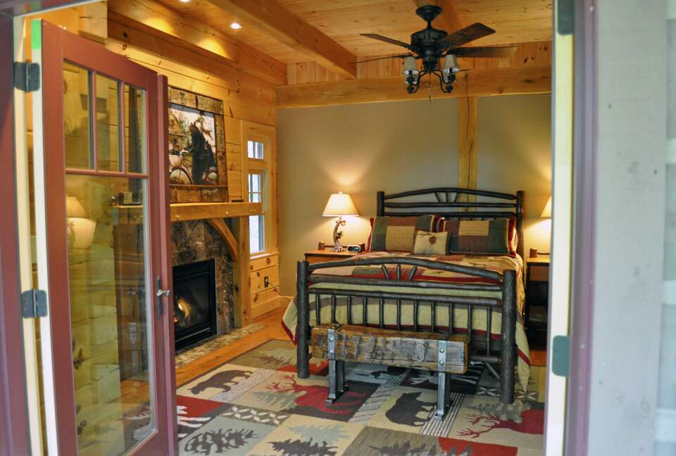 Home Exchange in Greentown, PA, master bedroom with fireplace