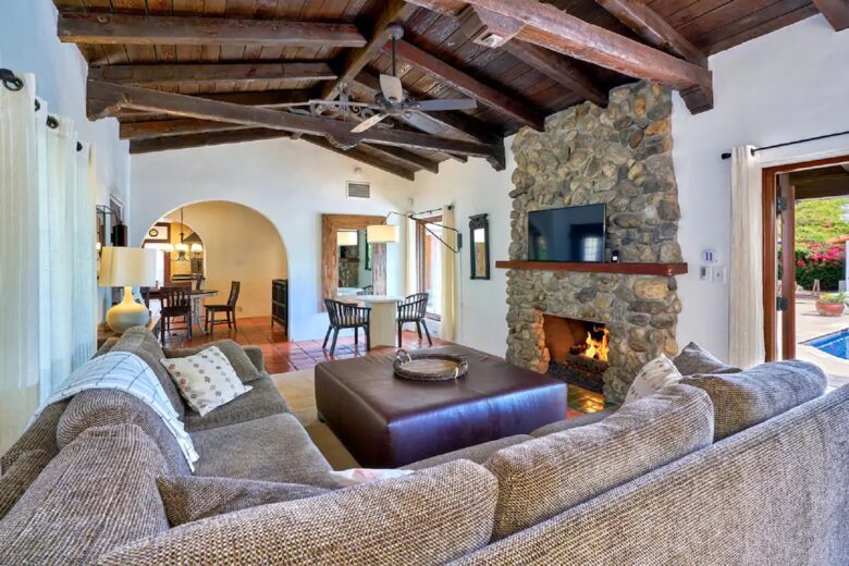 Home Exchange in Palm Springs, CA family room with stone fireplace