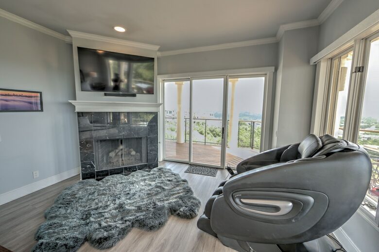 Home Exchange in Austin, TX master suite fireplace, tv, and massager