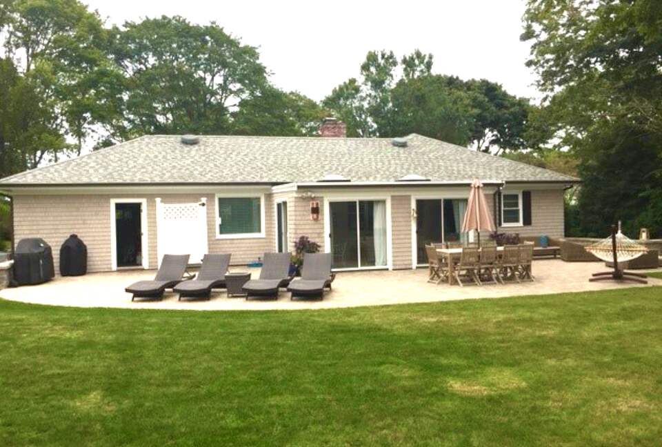 Back of house with dining, lounge and fire pit
