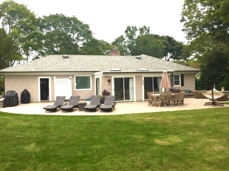 Back of house with dining, lounge and fire pit