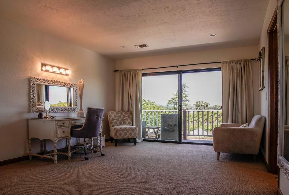 Home Exchange in Napa, CA bedroom with vanity and balcony