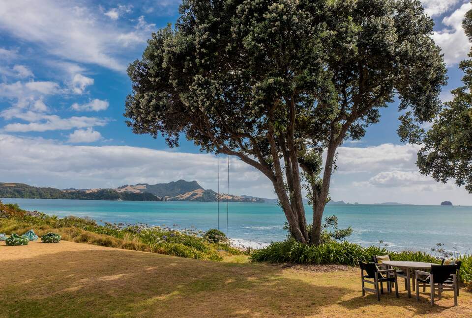 Home Exchange in Ferry Landing, Waikato, NZ lounge and swing