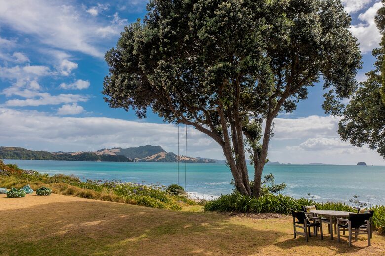 Home Exchange in Ferry Landing, Waikato, NZ lounge and swing