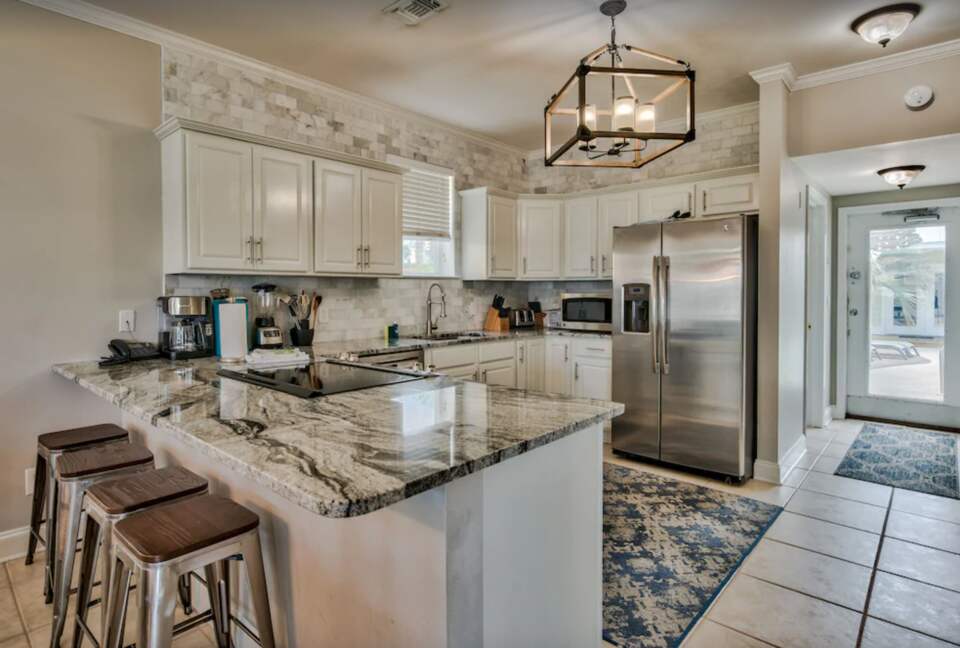 Kitchen with granite countertops and eat-in bar