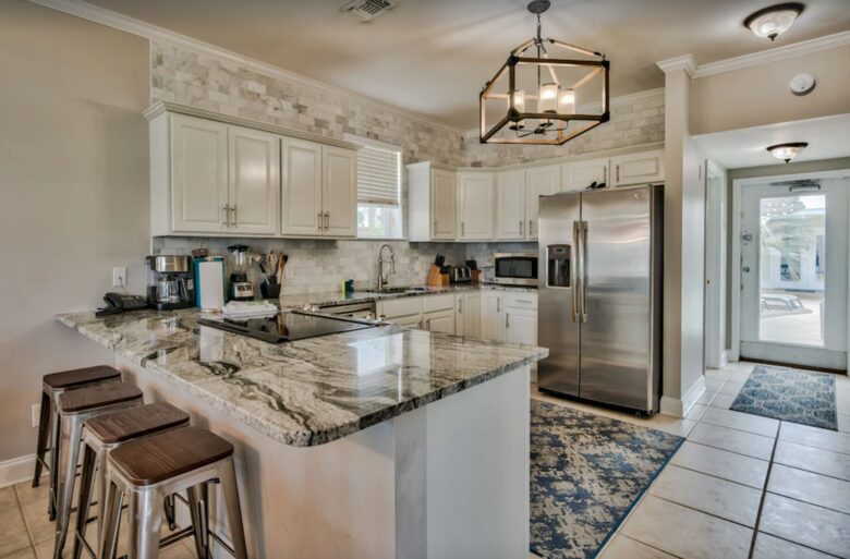 Kitchen with granite countertops and eat-in bar