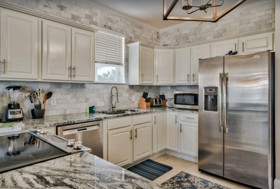 Kitchen with granite countertops and eat-in bar