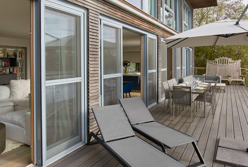 Terrace with sun loungers, bbq, table for 10 and sofa area