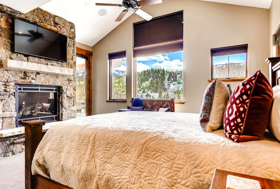 Home Exchange in Breckenridge, CO master suite with a fireplace