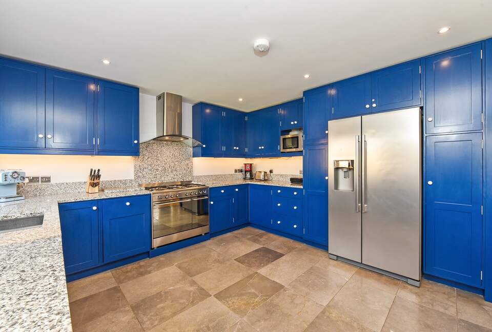 Solid wood bespoke kitchen. American style fridge/freezer