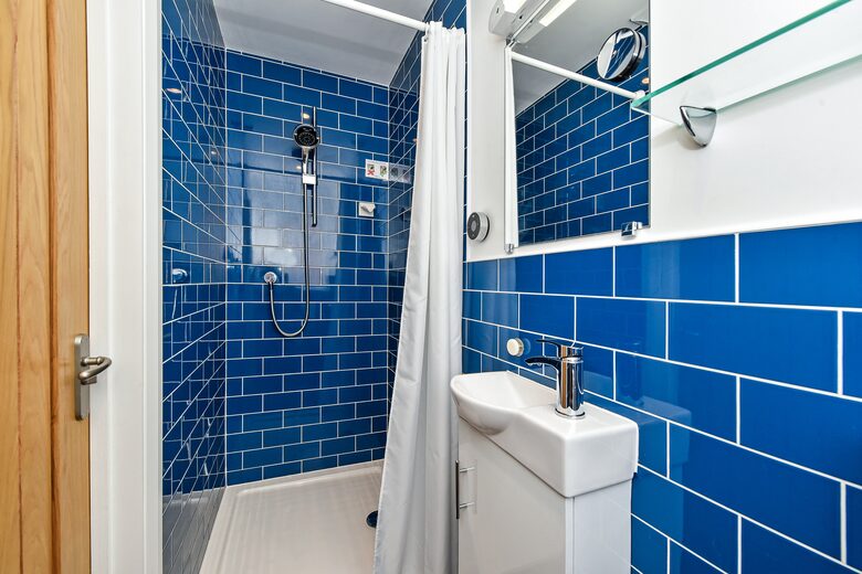 Master bedroom ensuite. Mira digital shower, sink & WC.