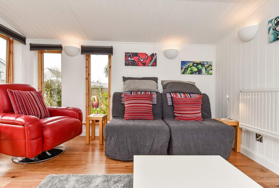 Garden room interior. Leather chair. Chair beds. Heating.