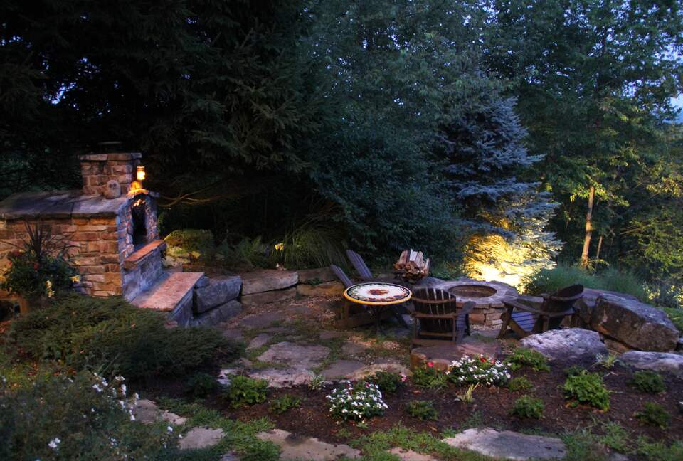 Pizza oven and firepit at night