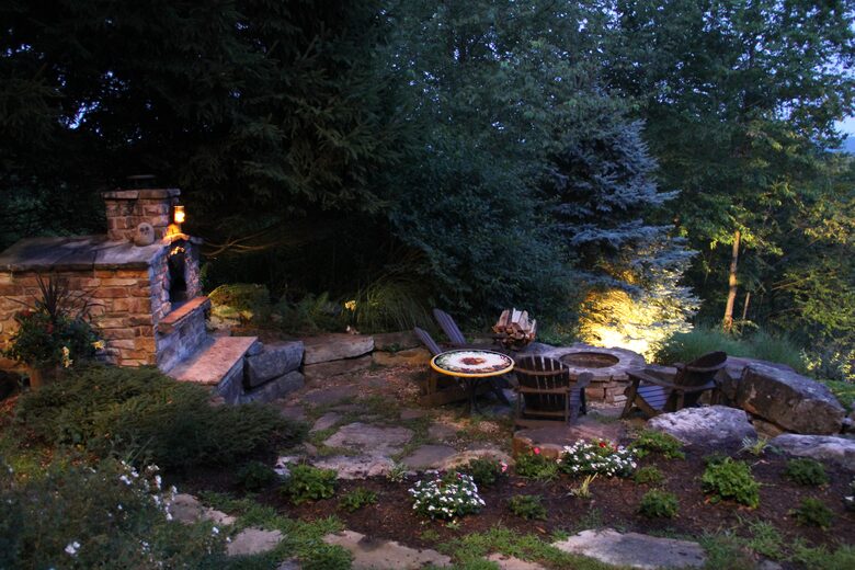 Pizza oven and firepit at night