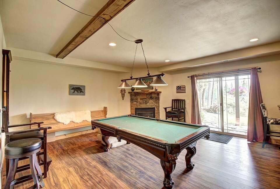 Home Exchange in Columbia Falls, Montana pool table with patio access