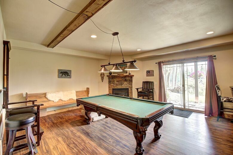 Home Exchange in Columbia Falls, Montana pool table with patio access