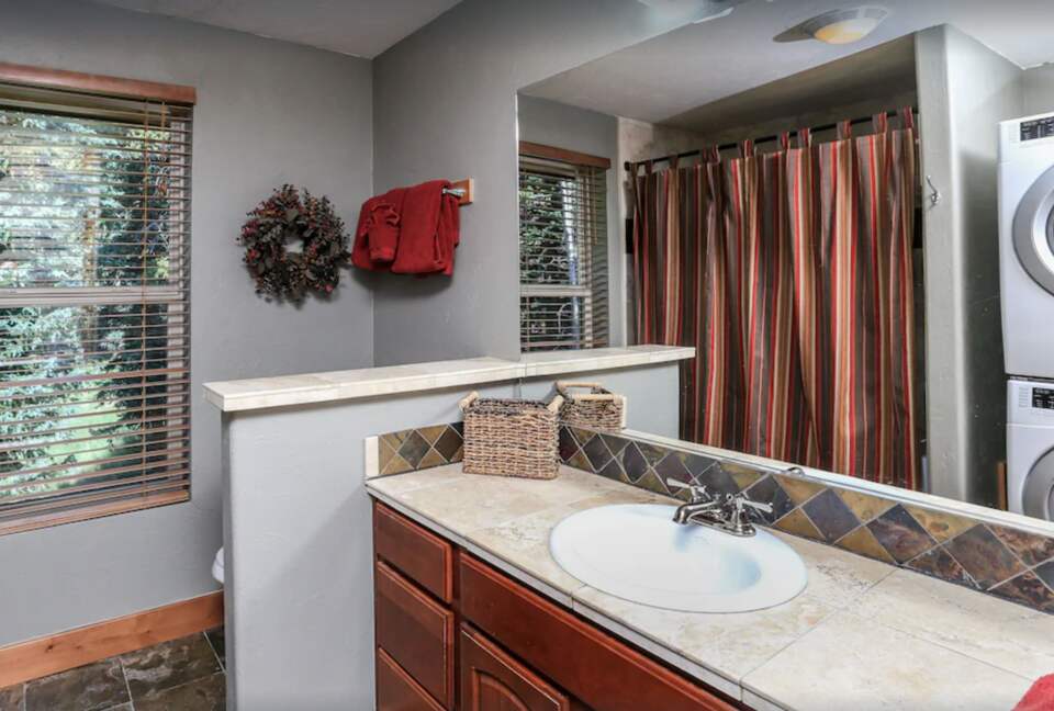 Top level bathroom next to queen bedroom