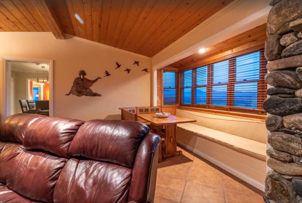 Open living room with fireplace and bench seating