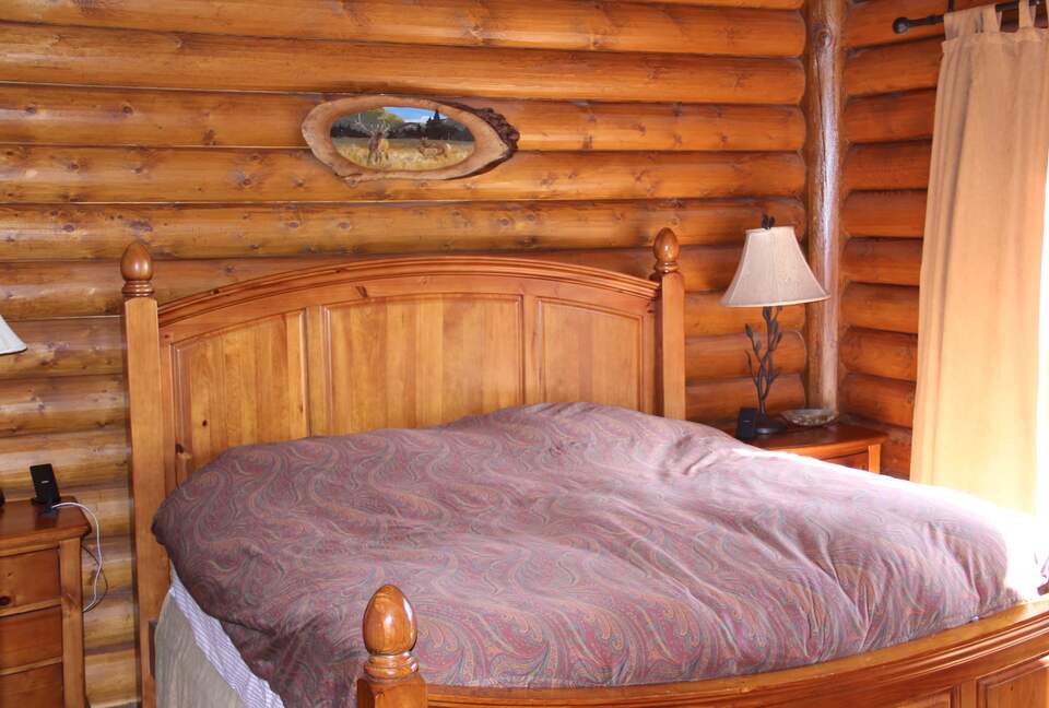 Master bedroom with private balcony and lake view