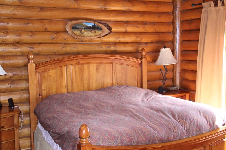 Master bedroom with private balcony and lake view