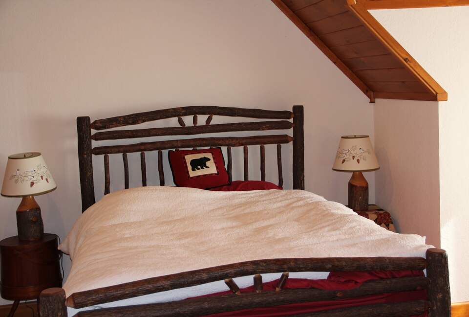 Upstairs bedroom with lake view; private bath