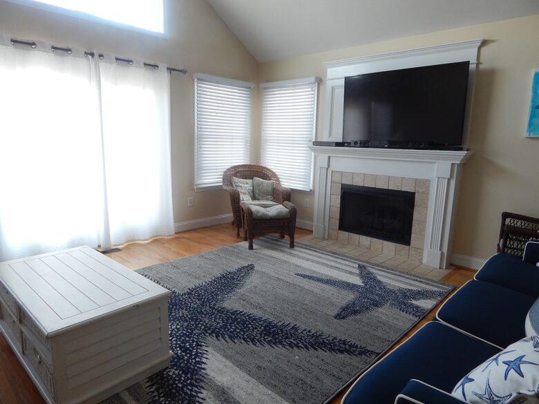 Home Exchange in Sea Isle City, NJ fireplace and large flat screen