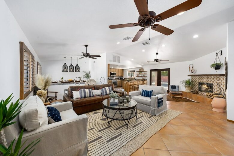 Home Exchange in La Quinta, CA family room with fireplace