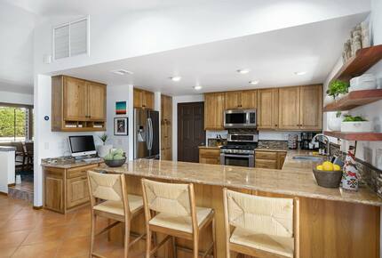 Home Exchange in La Quinta, CA kitchen with counter seating