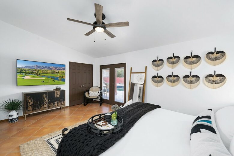Home Exchange in La Quinta, CA master bedroom with patio access