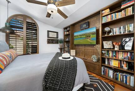 Home Exchange in La Quinta, CA queen bedroom with built in shelves